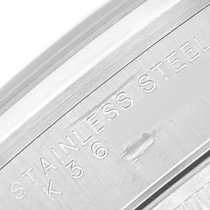 This close-up image shows the "STAINLESS STEEL" engraving on the side of a Rolex Air-King 14000 Men's Stainless Steel Pink Dial 14000 Men's Stainless Steel Pink Dial watch case.