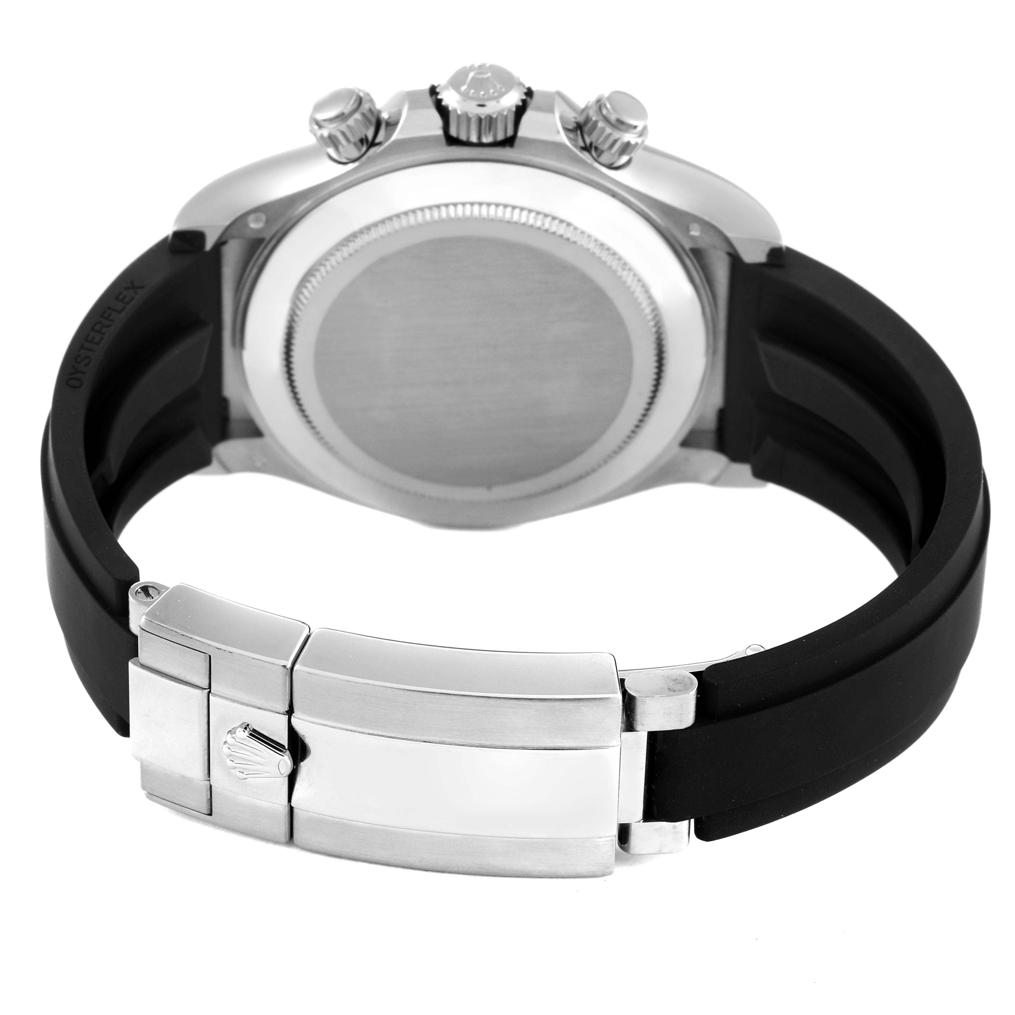 The image shows the back case and clasp of a Rolex Daytona 116519 Men's White Gold Grey Dial 116519 Men's White Gold Grey Dial watch with a black rubber strap.