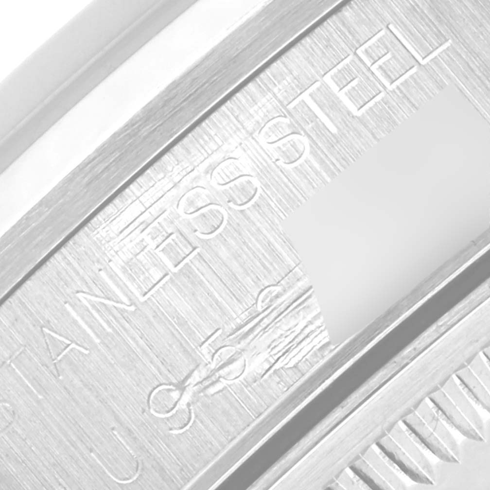 The image shows a close-up of the case back of a Rolex Date 15200 Men's Stainless Steel Blue Dial 15200 Men's Stainless Steel Blue Dial model, highlighting the stainless steel engraving.