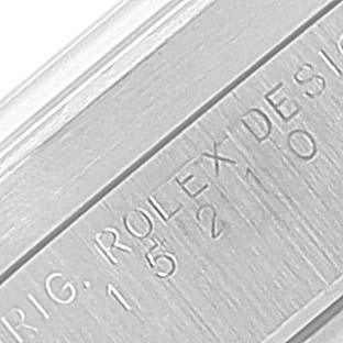 Close-up of the serial number engraving on the side of a Rolex Date 15210 Men's Stainless Steel White Dial 15210 Men's Stainless Steel White Dial model wristwatch.