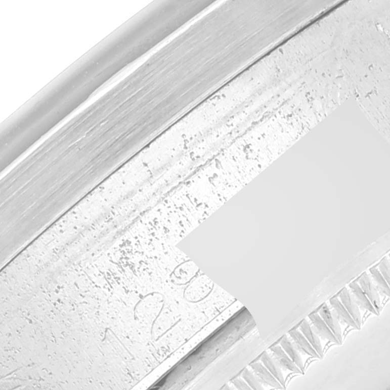 This close-up image shows the side of the case and the serial number engraving on the Rolex Vintage Collection 1501 Men's Stainless Steel White Dial 1501 Men's Stainless Steel White Dial model.