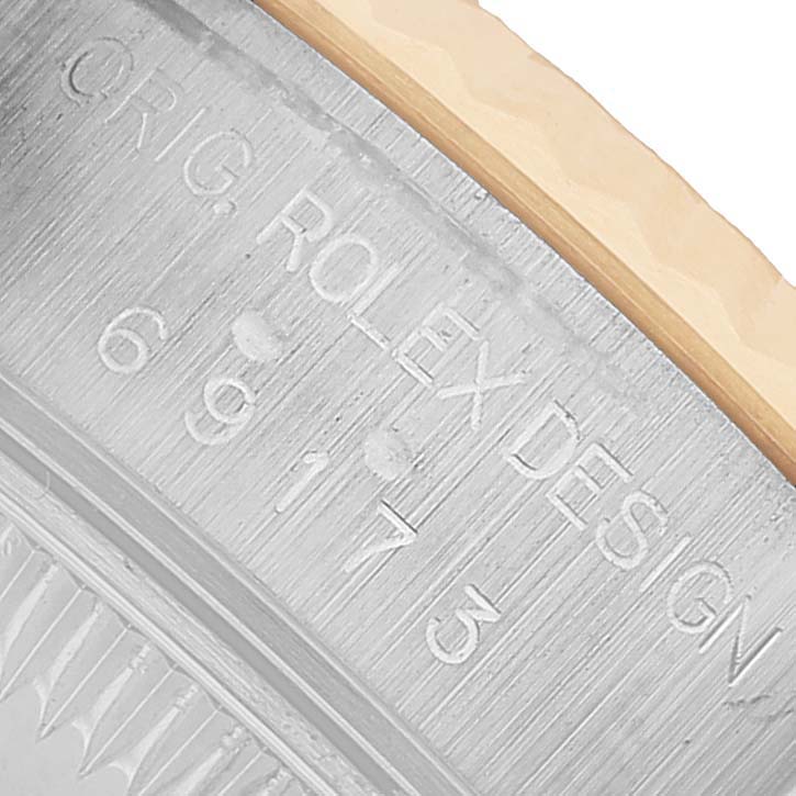The image shows the side engraving of a Rolex Datejust 69173 Women's Steel and Gold (two tone) Champagne Dial model, featuring the "ORIG. ROLEX DESIGN" text and model number.