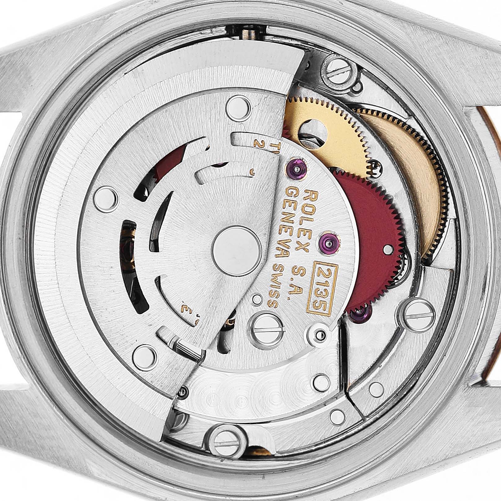 This image shows the movement mechanism of a Rolex Datejust 69173 Women's Steel and Gold (two tone) Champagne Dial, viewed from the back case, highlighting gears and components.