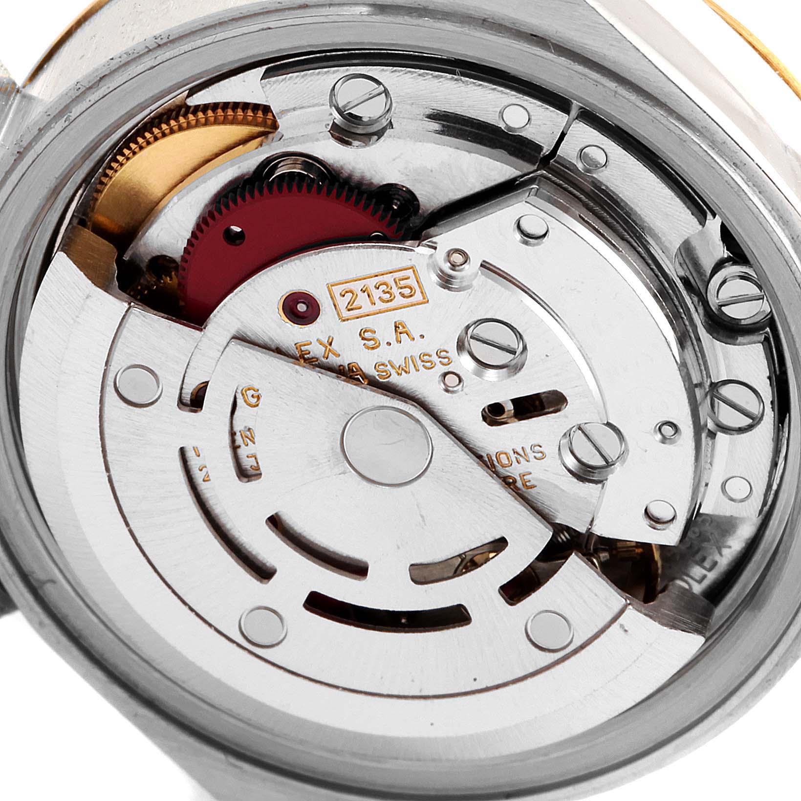 This image shows a close-up of the movement mechanism of a Rolex Datejust 69173 Women
s Steel and Gold (two tone) Champagne Dial 69173 Women
s Steel and Gold (two tone) Champagne Dial watch, highlighting its internal components.