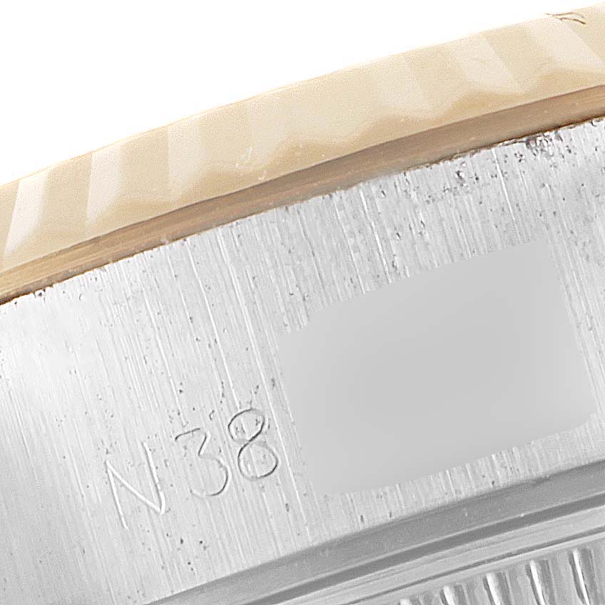 This image shows a macro view of the serial number engraving on the bezel of a Rolex Datejust 69173 Women
s Steel and Gold (two tone) Champagne Dial 69173 Women
s Steel and Gold (two tone) Champagne Dial watch.