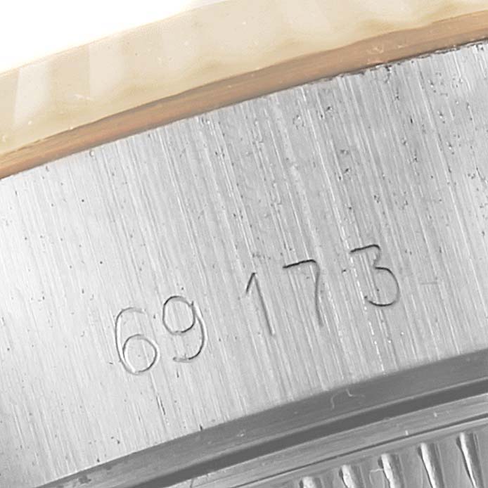 This image shows a close-up of the side of a Rolex Datejust 69173 Women
s Steel and Gold (two tone) Champagne Dial 69173 Women
s Steel and Gold (two tone) Champagne Dial watch, focusing on the model number engraving.