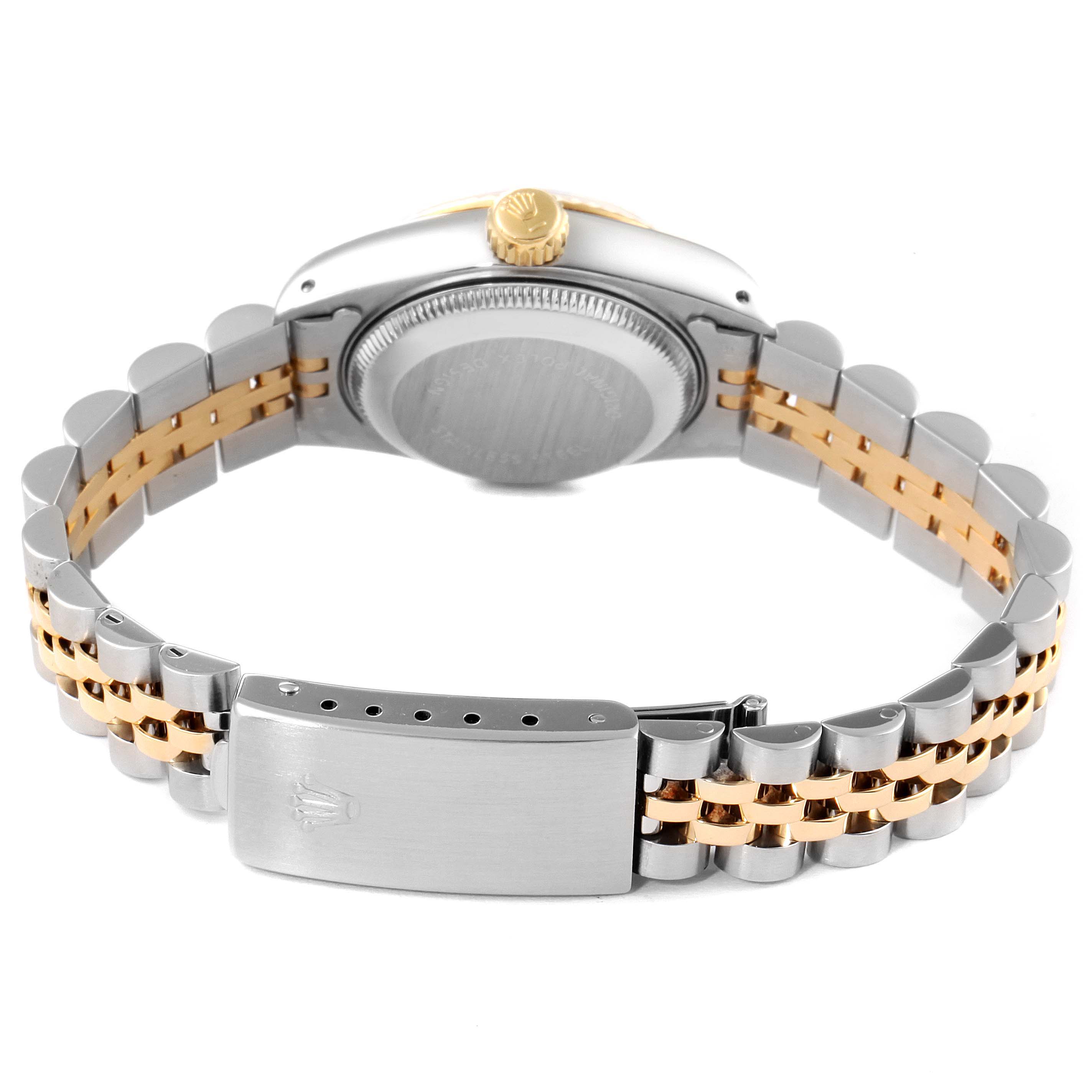 This image shows the back of the Rolex Datejust 69173 Women
s Steel and Gold (two tone) Champagne Dial 69173 Women
s Steel and Gold (two tone) Champagne Dial watch, highlighting its case back and two-tone bracelet with a clasp.