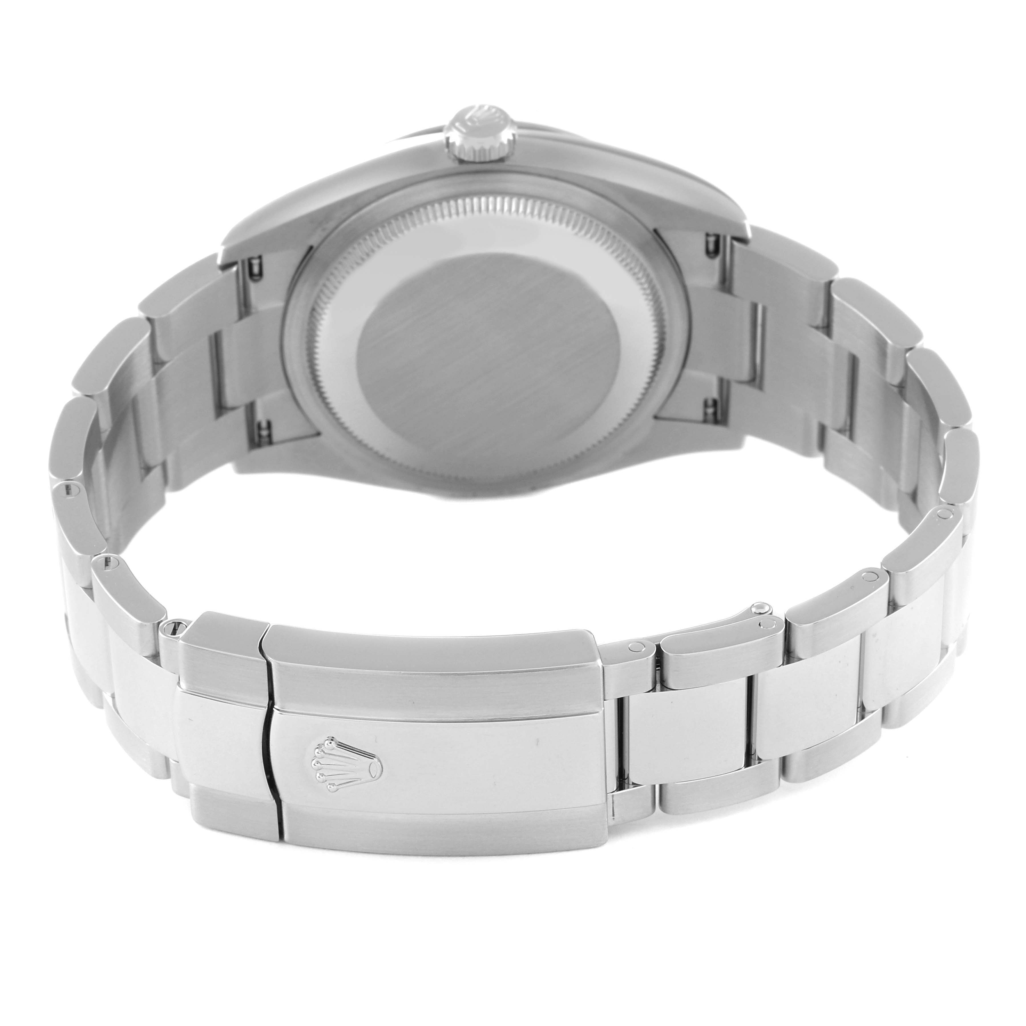 The image shows the back, clasp, and bracelet of a Rolex Datejust 126200 Men's Stainless Steel Green Dial 126200 Men's Stainless Steel Green Dial watch, angled to display the closed clasp and case back.