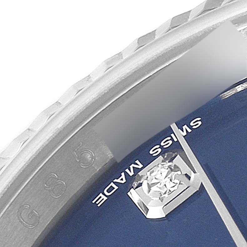 This close-up angle shows part of the bezel, dial, and diamond marker of a Rolex Datejust 116234 Men's Stainless Steel Blue Dial 116234 Men's Stainless Steel Blue Dial watch.