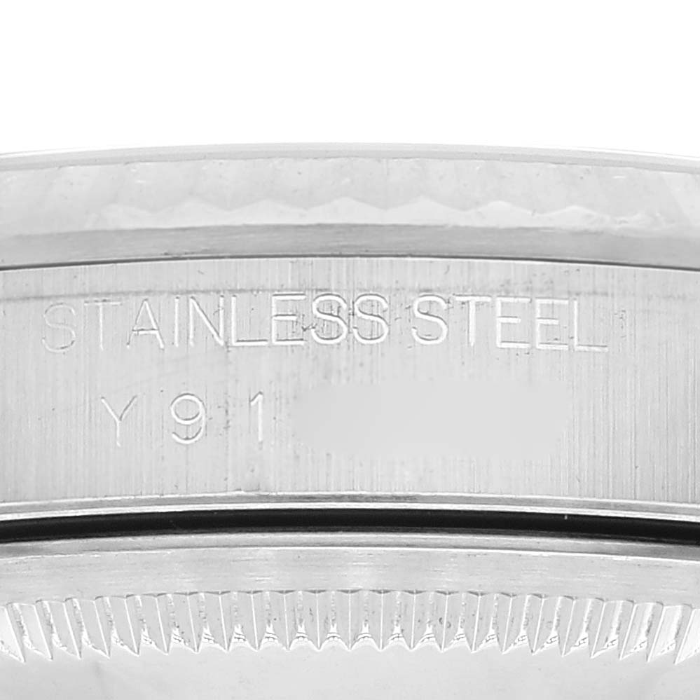 The image shows a close-up of the case back and part of the fluted bezel of a Rolex Datejust 16234 Men's Stainless Steel Silver Dial 16234 Men's Stainless Steel Silver Dial watch, displaying "STAINLESS STEEL."