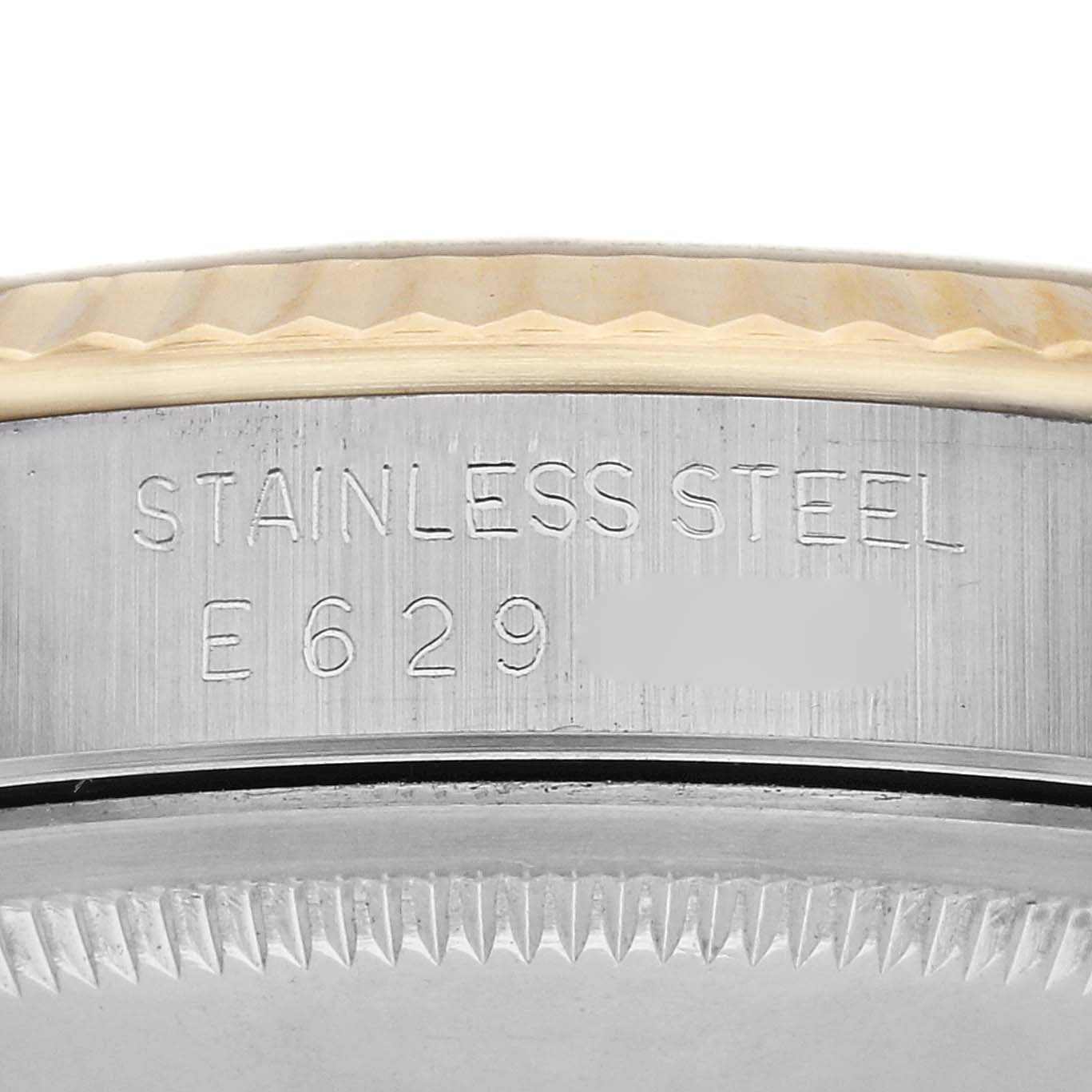 The image shows a close-up side view of the Rolex Datejust 16233 Men's Steel and Gold (two tone) Champagne Dial 16233 Men's Steel and Gold (two tone) Champagne Dial, featuring the stainless steel case with engraved details.