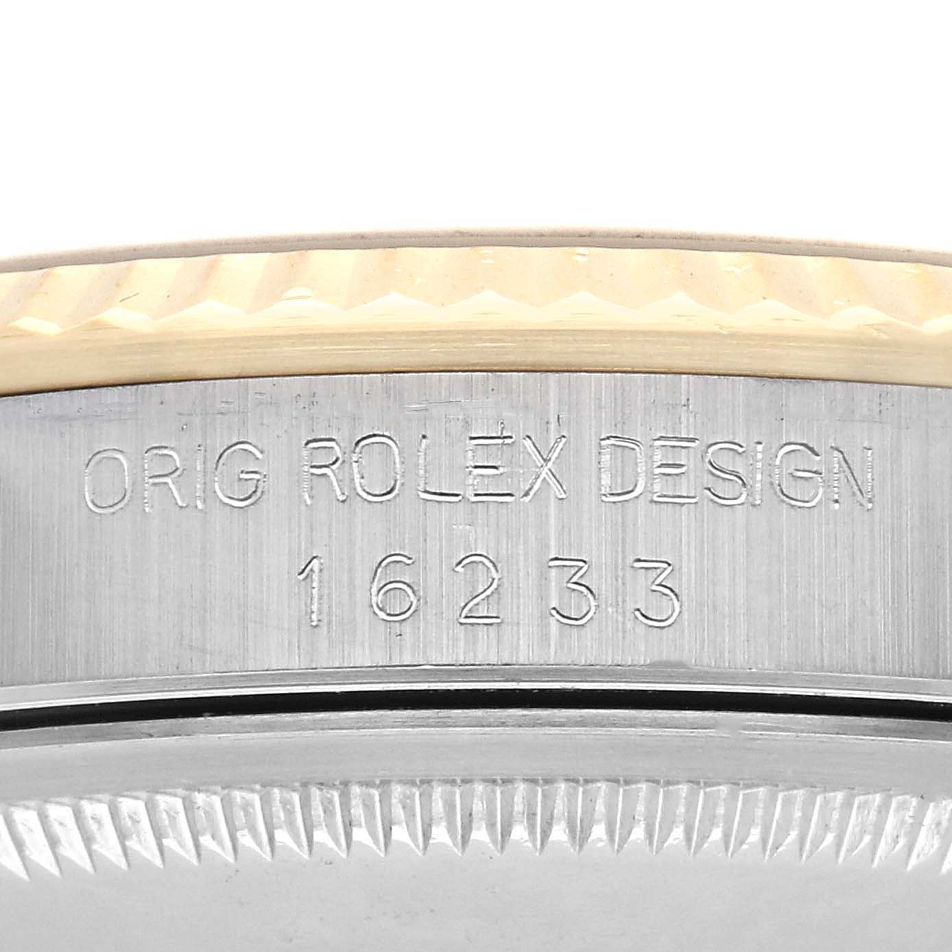 The image shows a close-up of the side of a Rolex Datejust 16233 Men's Steel and Gold (two tone) Champagne Dial 16233 Men's Steel and Gold (two tone) Champagne Dial, highlighting the engraved reference number and part of the bezel.