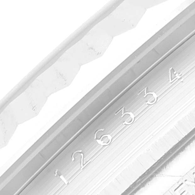 The image shows a close-up of the bezel and part of the fluted edge of the Rolex Datejust 41 126334 Men's Stainless Steel Blue Dial 126334 Men's Stainless Steel Blue Dial.