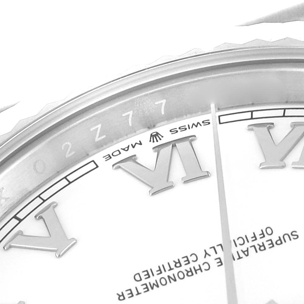 This close-up image of the Rolex Datejust 41 126334 Men's Stainless Steel White Dial 126334 Men's Stainless Steel White Dial watch shows the dial with Roman numerals and part of the bezel from an angled view.