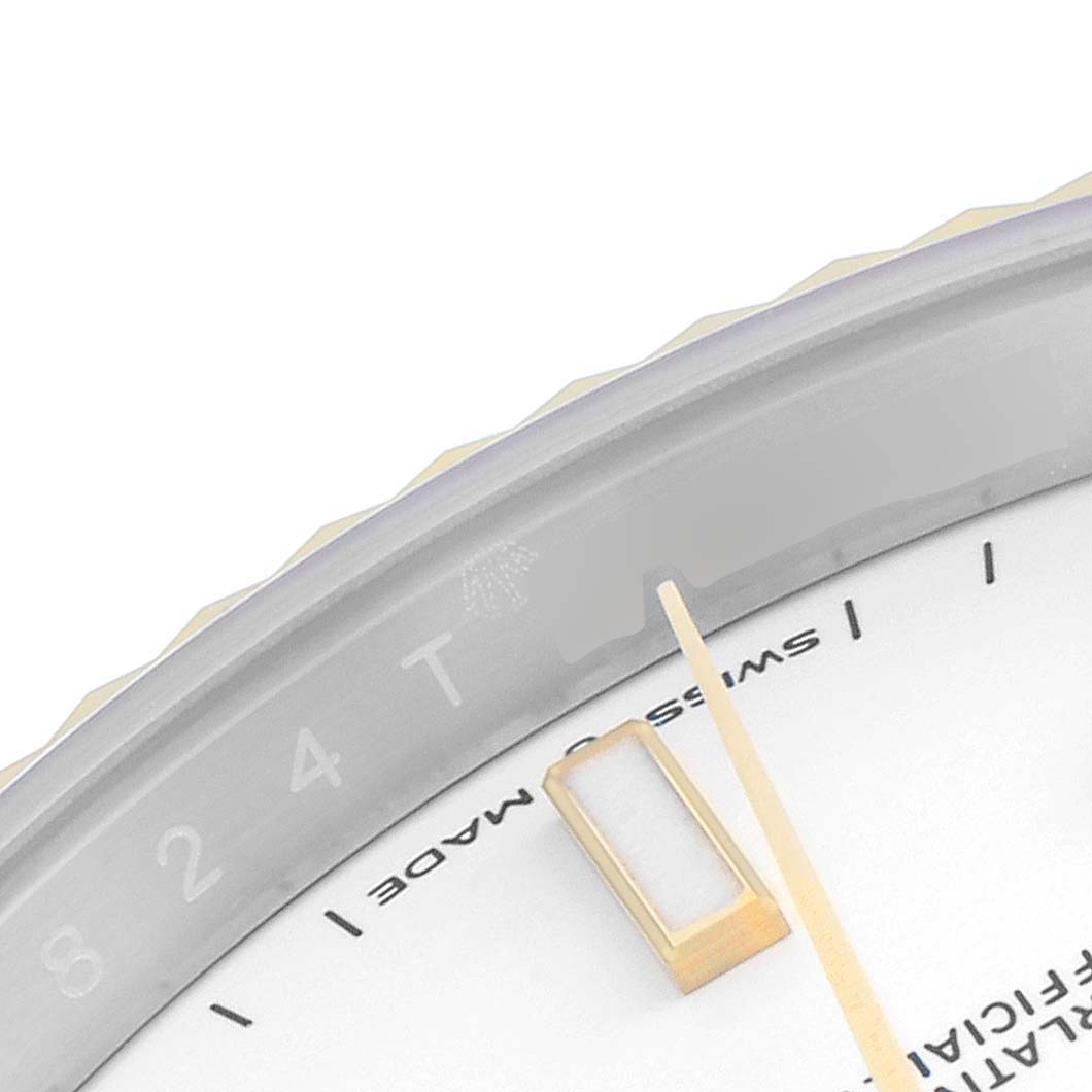 This image shows a close-up, angled view of the bezel and part of the dial of a Rolex Datejust 41 126333 Men's Steel and Gold (two tone) White Dial 126333 Men's Steel and Gold (two tone) White Dial watch.