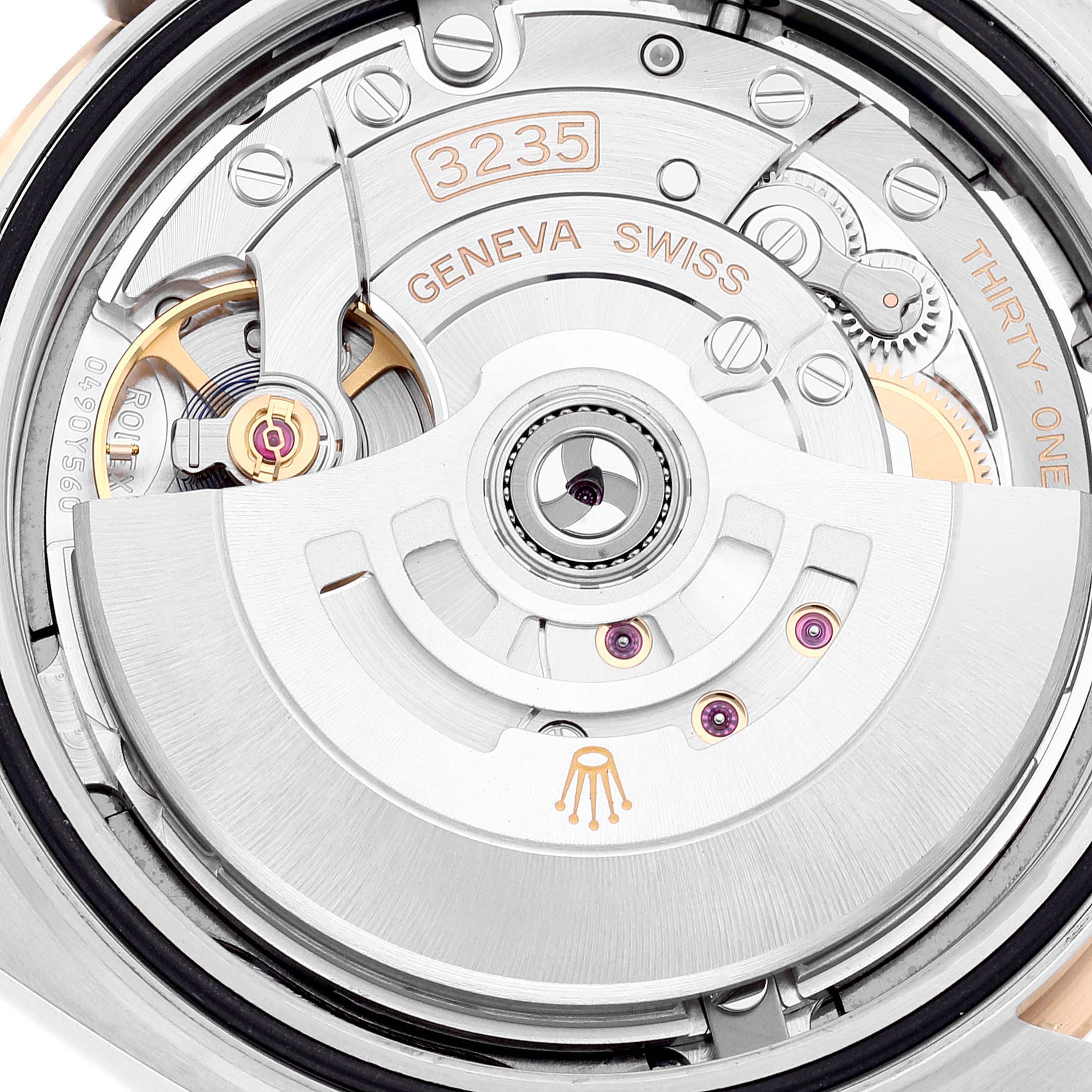 This image shows a close-up of the movement and rotor of a Rolex Datejust 41 126333 Men's Steel and Gold (two tone) Grey Dial 126333 Men's Steel and Gold (two tone) Grey Dial watch, focusing on the detailed mechanical parts.