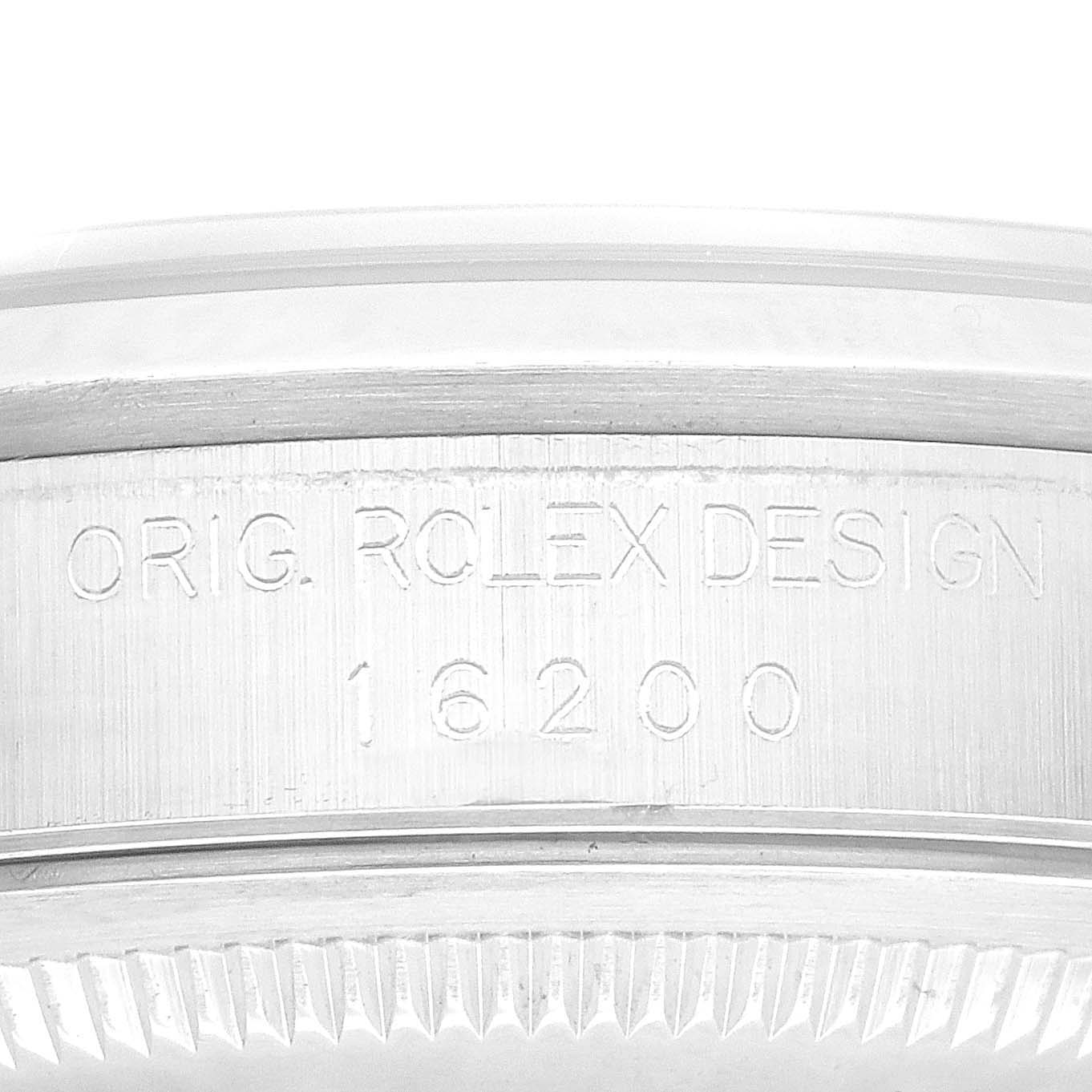 This is a close-up shot of the case side engraving on a Rolex Datejust 16200 Men's Stainless Steel Blue Dial 16200 Men's Stainless Steel Blue Dial Model 16200.