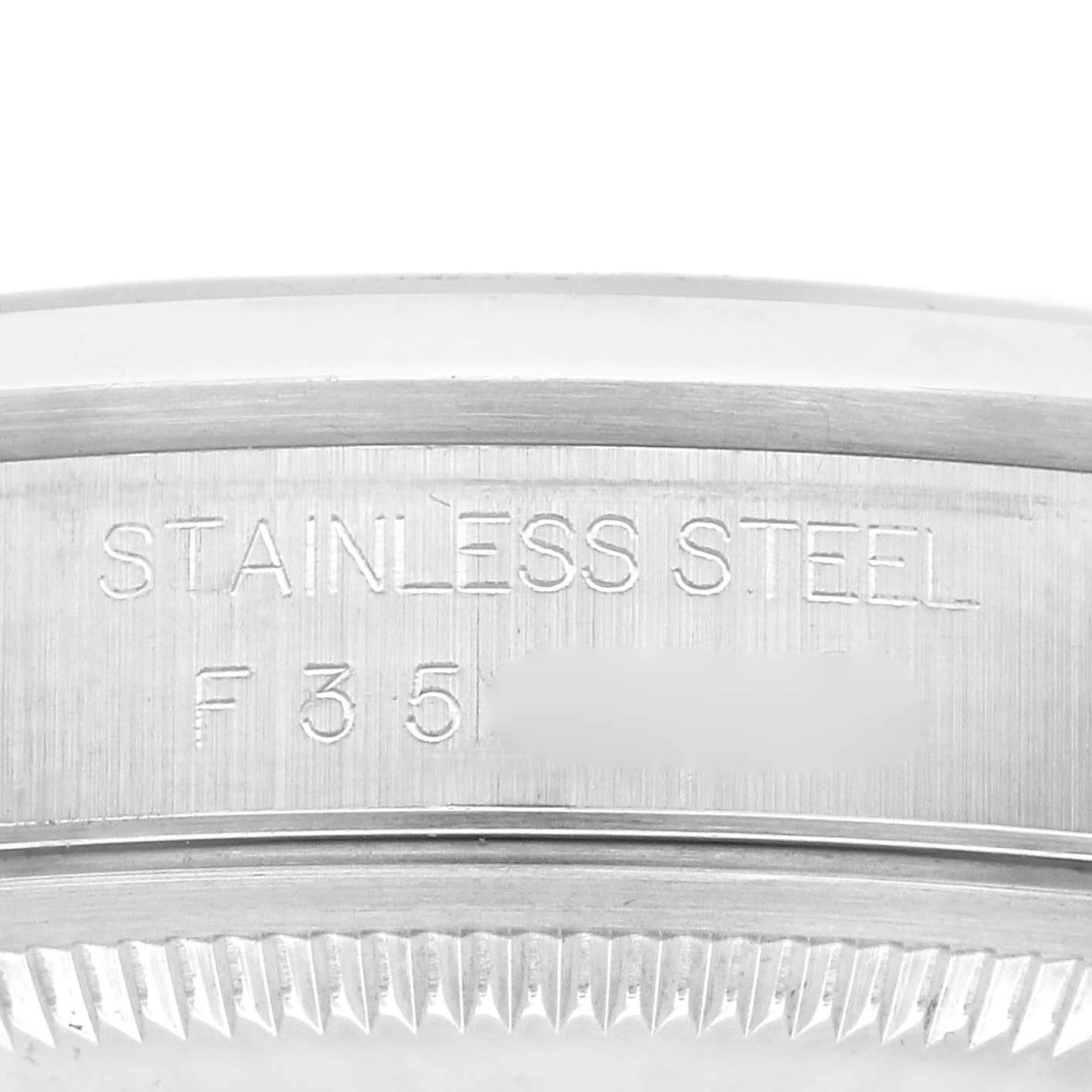 Close-up of the Rolex Datejust 16200 Men's Stainless Steel Blue Dial 16200 Men's Stainless Steel Blue Dial model showing the side engraving on the stainless steel casing.