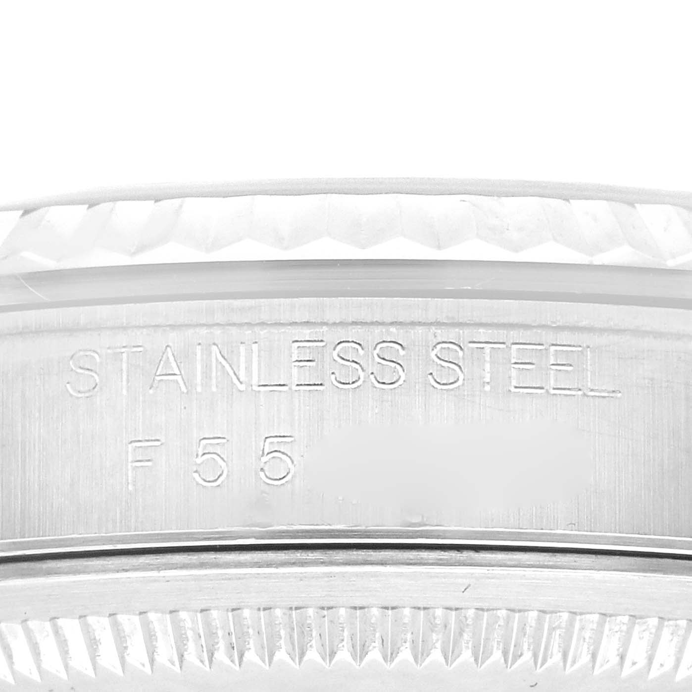 This close-up image shows the stainless steel engraving on the bezel or case of a Rolex Datejust 16234 Men's Stainless Steel Silver Dial 16234 Men's Stainless Steel Silver Dial watch.