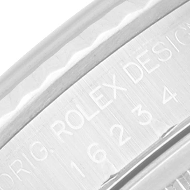 This close-up image shows the engraved details on the case side of a Rolex Datejust 16234 Men's Stainless Steel Mother of Pearl Dial 16234 Men's Stainless Steel Mother of Pearl Dial watch.