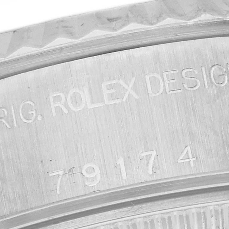 This image shows a close-up of the case detailing and model number on a Rolex Datejust 179174 Women
s Stainless Steel Mother of Pearl Dial 179174 Women
s Stainless Steel Mother of Pearl Dial watch.