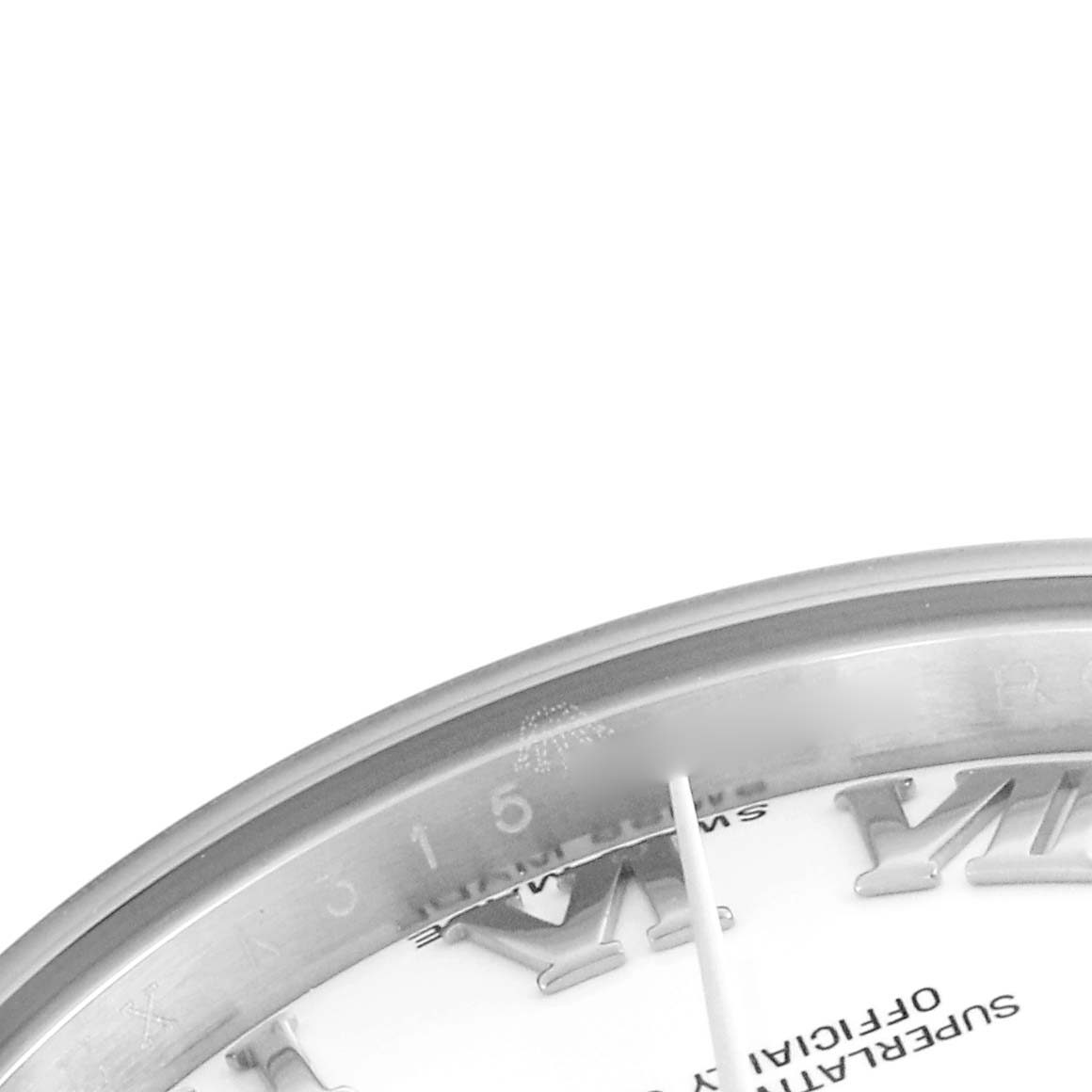 The image shows a close-up of the Rolex Datejust 179174 Women's Stainless Steel White Dial 179174 Women's Stainless Steel White Dial watch's dial, focusing on the bezel, part of the minute markers, and the edge of the hour markers.