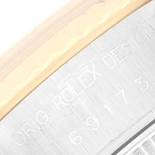 This image shows a close-up of the Rolex Datejust 69173 Women's Steel and Gold (two tone) Champagne Dial 69173 Women's Steel and Gold (two tone) Champagne Dial watch's case back with engraved text.