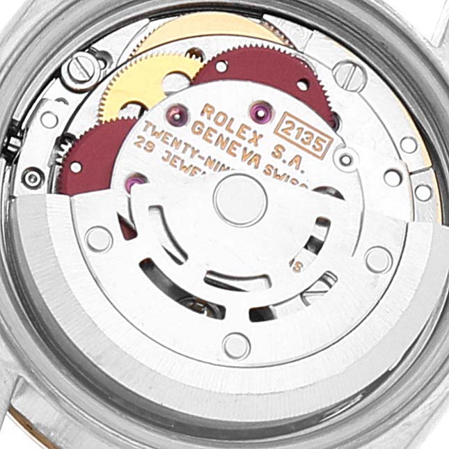 The image shows a close-up view of the movement mechanism of a Rolex Datejust 69173 Women
s Steel and Gold (two tone) Grey Dial 69173 Women
s Steel and Gold (two tone) Grey Dial watch.