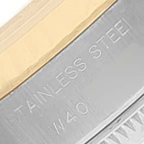 The image shows a close-up angle of the stainless steel part of a Rolex Datejust 69173 Women
s Steel and Gold (two tone) Grey Dial 69173 Women
s Steel and Gold (two tone) Grey Dial watch with the engraving "STAINLESS STEEL."