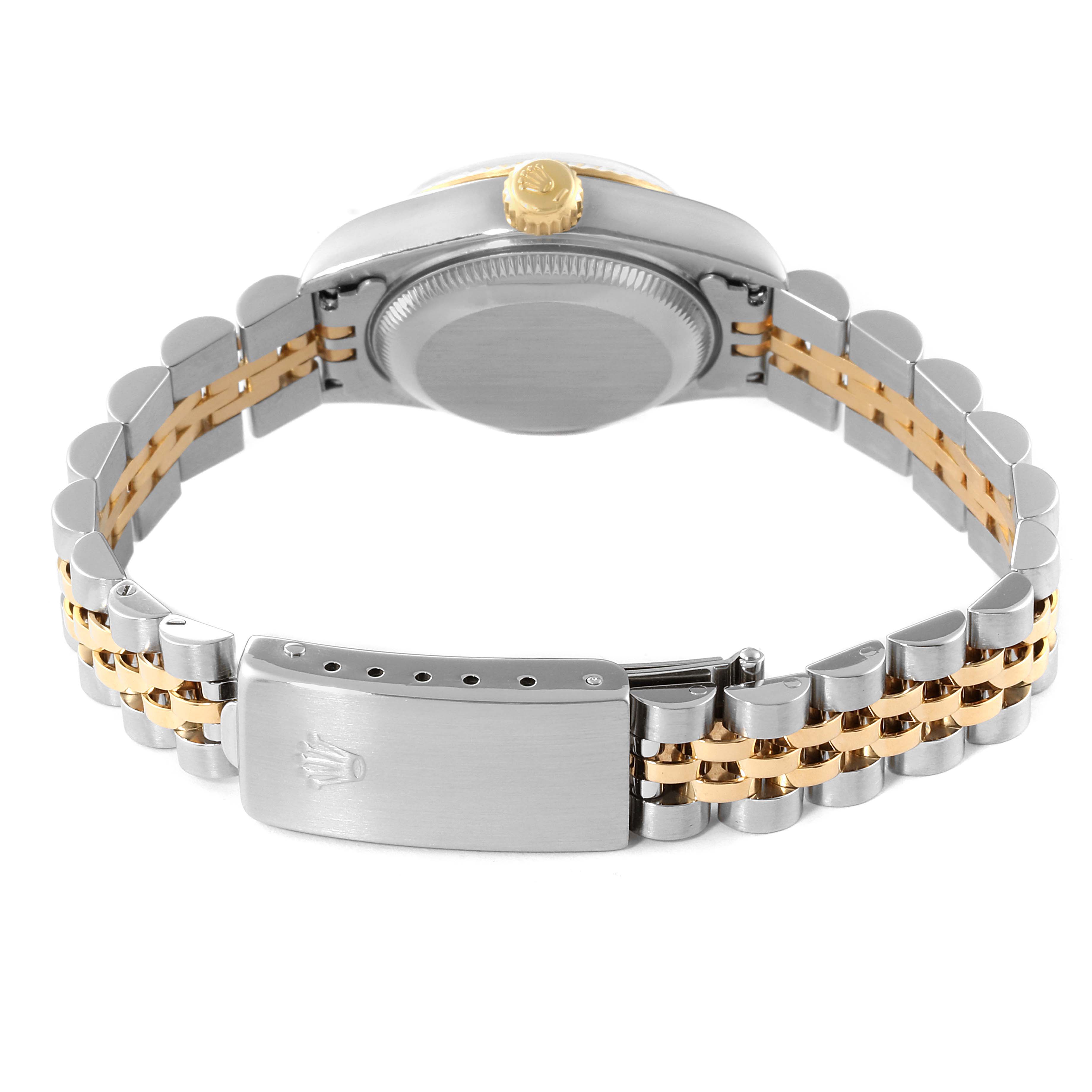 The image shows the back view of a Rolex Datejust 69173 Women
s Steel and Gold (two tone) Grey Dial 69173 Women
s Steel and Gold (two tone) Grey Dial watch, highlighting its case, crown, and Jubilee bracelet.