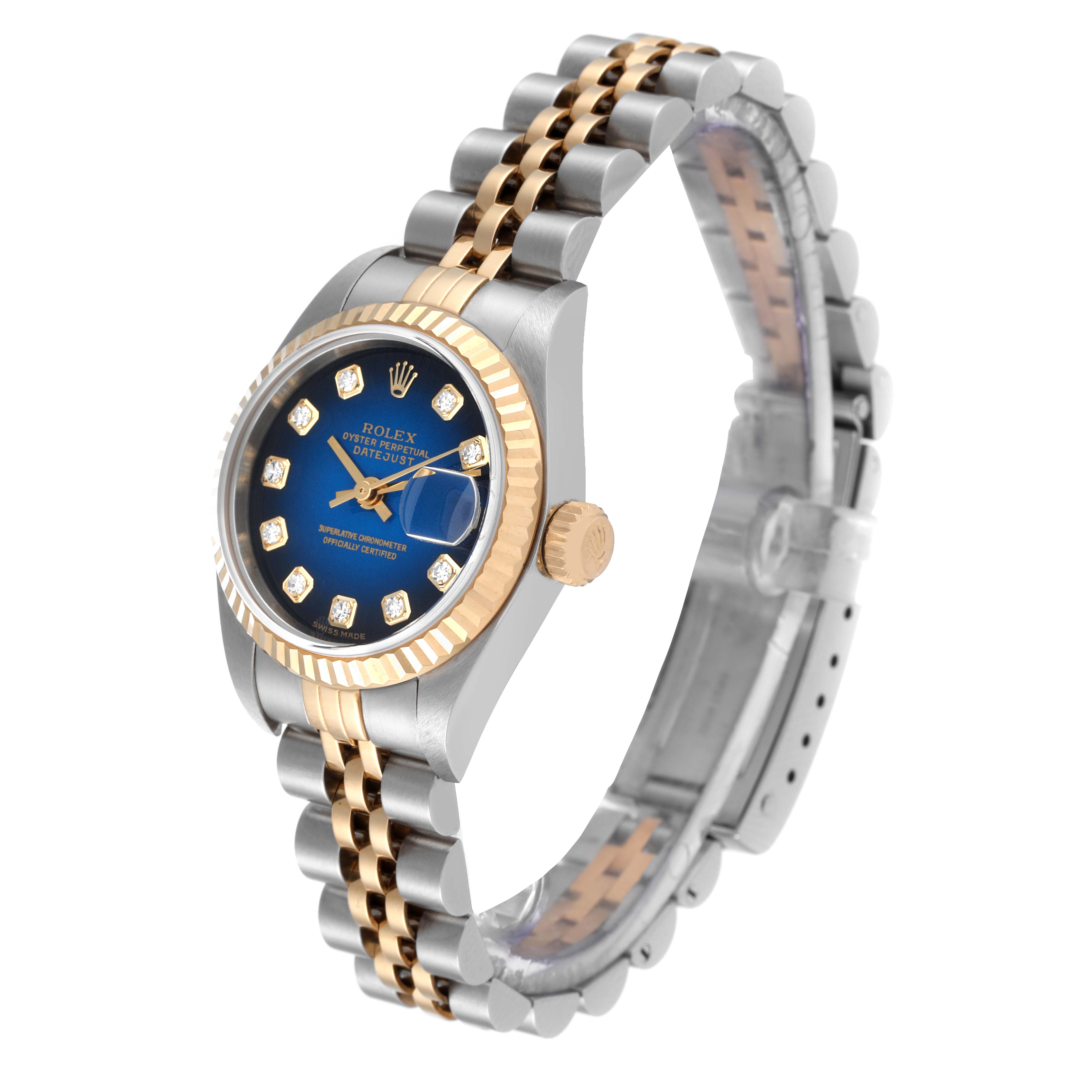 This image shows a Rolex Datejust 79173 Women's Steel and Gold (two tone) Blue Dial 79173 Women's Steel and Gold (two tone) Blue Dial watch at a slight angle, highlighting its blue dial, diamond hour markers, and two-tone bracelet.