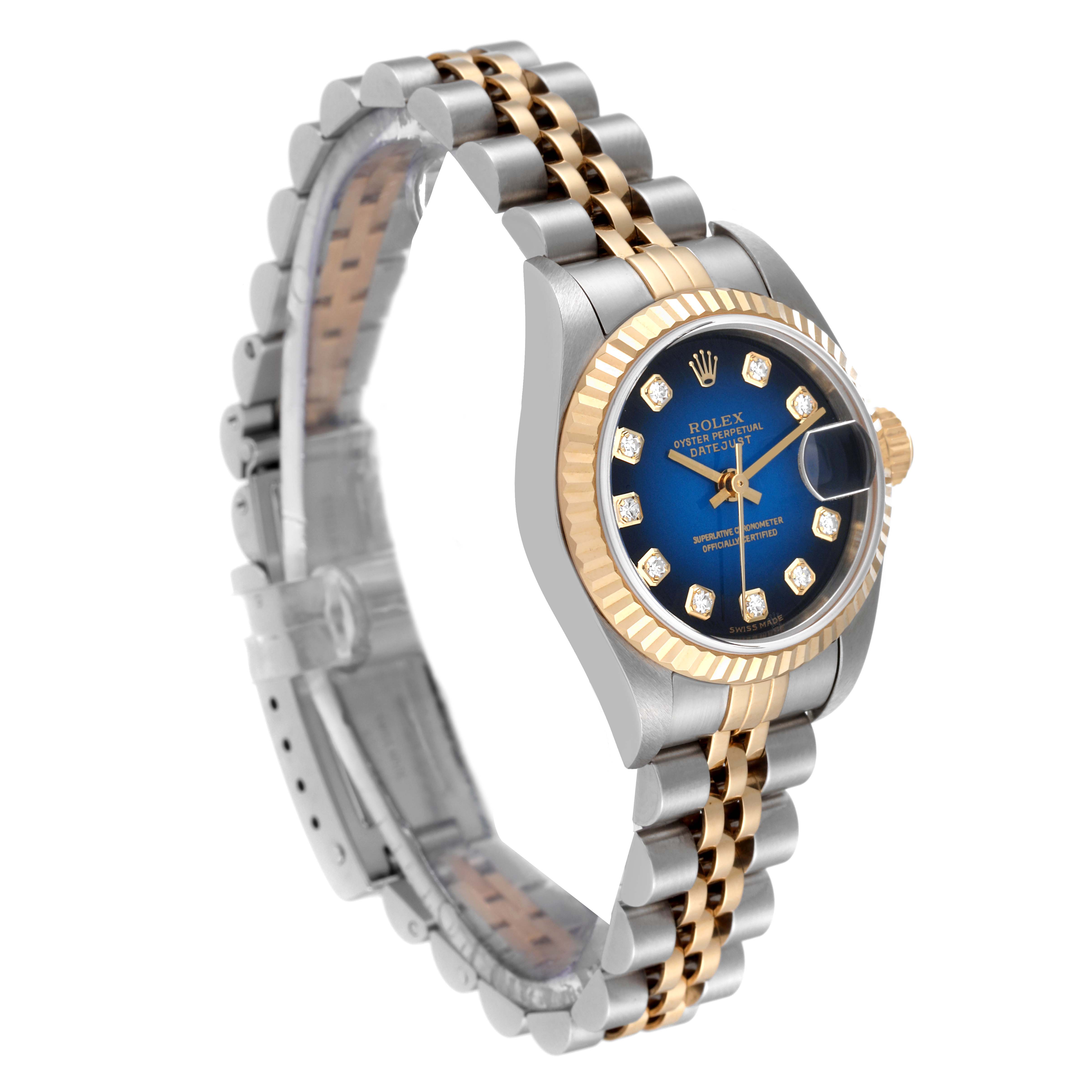 The Rolex Datejust 79173 Women's Steel and Gold (two tone) Blue Dial 79173 Women's Steel and Gold (two tone) Blue Dial watch is photographed at an angle showing the face, bezel, and part of the bracelet.