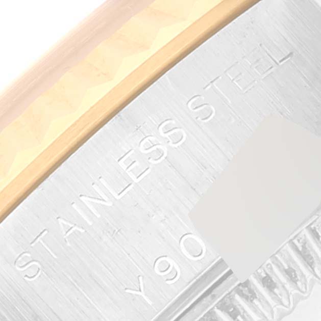This image shows a close-up of the case back and side of a Rolex Datejust 79173 Women's Steel and Gold (two tone) Blue Dial 79173 Women's Steel and Gold (two tone) Blue Dial watch showcasing its stainless steel material.