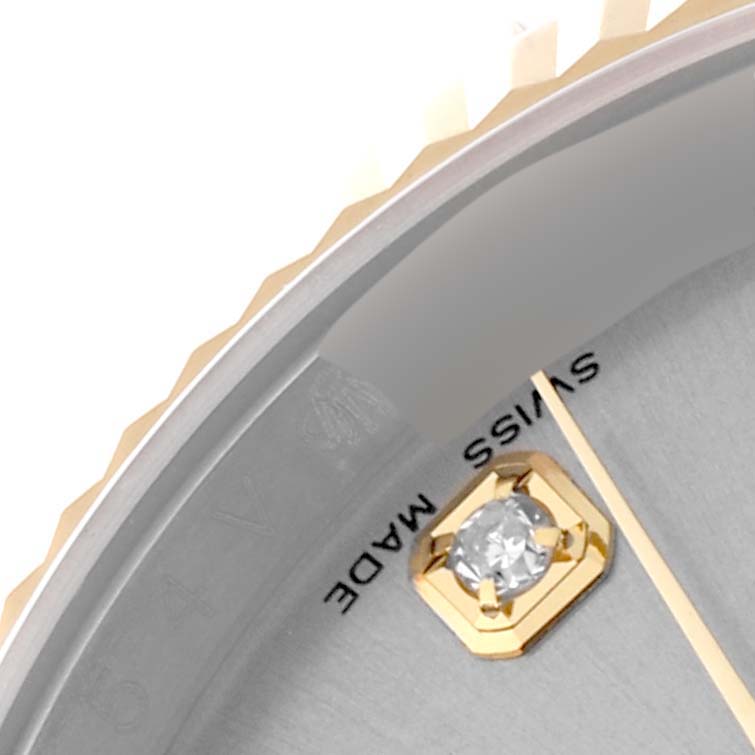 This close-up angle shows the bezel, dial, and a diamond marker of the Rolex Datejust 116233 Men's Steel and Gold (two tone) Silver Dial 116233 Men's Steel and Gold (two tone) Silver Dial watch.