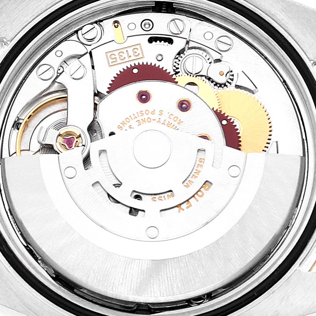 This image shows the intricate inner mechanism of a Rolex Datejust 116233 Men's Steel and Gold (two tone) Silver Dial 116233 Men's Steel and Gold (two tone) Silver Dial watch, highlighting its automatic movement components.