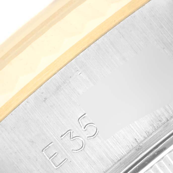 The image shows a close-up view of the serial number engraving on the side of a Rolex Datejust 69173 Women's Steel and Gold (two tone) Champagne Dial 69173 Women's Steel and Gold (two tone) Champagne Dial model watch.