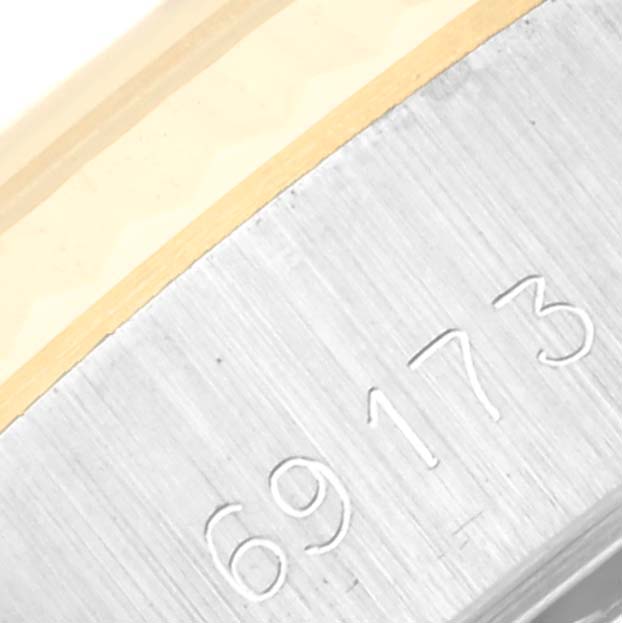 This close-up image shows the model number engraved on the side of the Rolex Datejust 69173 Women's Steel and Gold (two tone) Champagne Dial 69173 Women's Steel and Gold (two tone) Champagne Dial watch case.