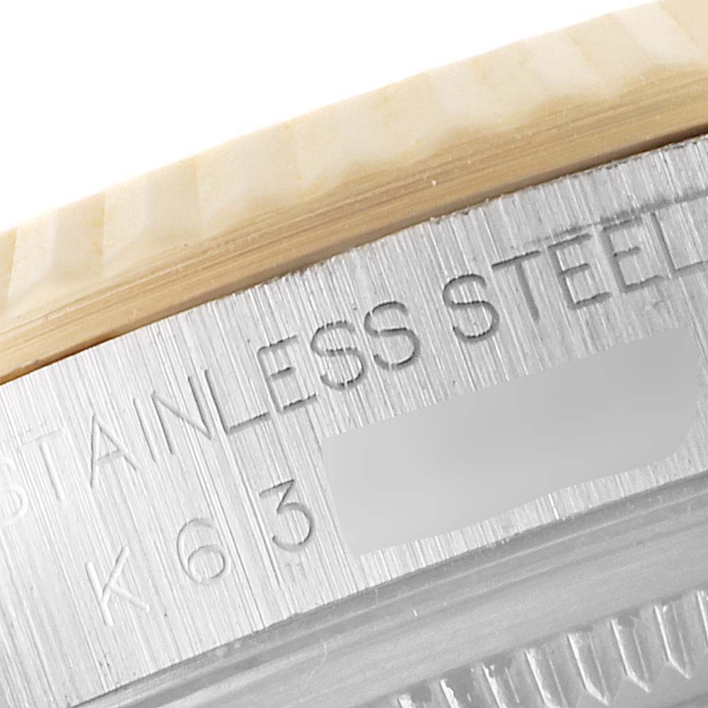 The image shows a close-up of the case back engraving of a Rolex Datejust 16233 Men's Steel and Gold (two tone) Mother of Pearl Dial 16233 Men's Steel and Gold (two tone) Mother of Pearl Dial watch, focusing on the stainless steel designation.