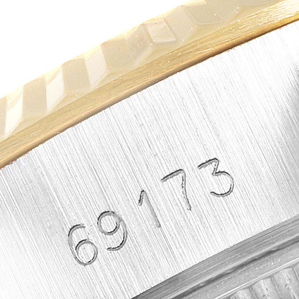 Close-up of the Rolex Datejust 69173 Women
s Steel and Gold (two tone) Silver Dial 69173 Women
s Steel and Gold (two tone) Silver Dial model showing the model number "69173" engraved on the side of the case.
