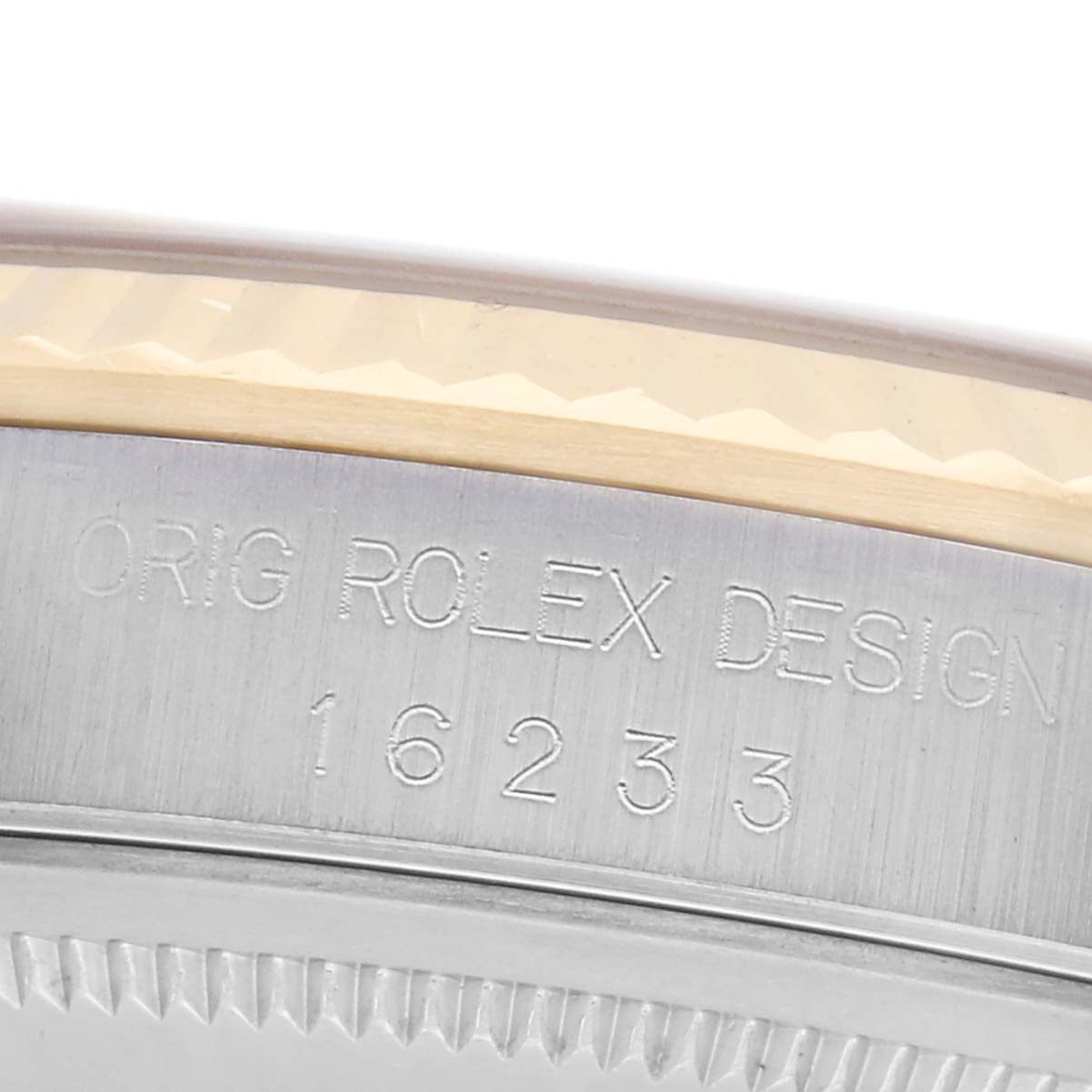 The image shows the side view of a Rolex Datejust 16233 Men's Steel and Gold (two tone) Silver Dial 16233 Men's Steel and Gold (two tone) Silver Dial model, focusing on the engraved design number "16233" on the case edge.