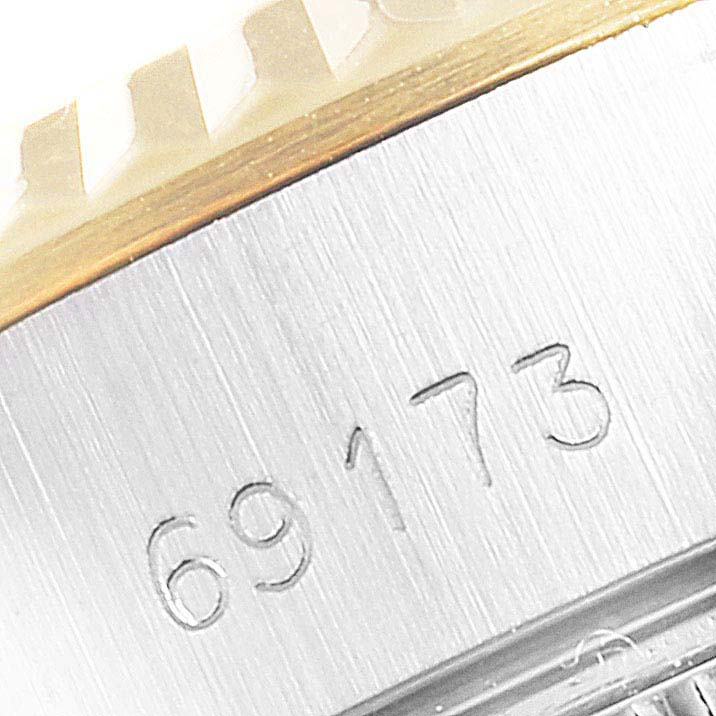 This image shows a close-up view of the band and serial number "69173" on a Rolex Datejust 69173 Women
s Steel and Gold (two tone) White Dial 69173 Women
s Steel and Gold (two tone) White Dial watch.