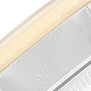 This close-up image shows part of the bezel and case, including a partial serial number, of a Rolex Datejust 69173 Women's Steel and Gold (two tone) White Dial 69173 Women's Steel and Gold (two tone) White Dial watch.