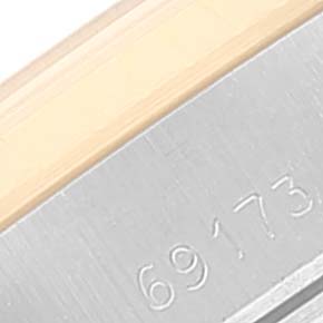 This is a close-up view of the side of a Rolex Datejust 69173 Women's Steel and Gold (two tone) White Dial 69173 Women's Steel and Gold (two tone) White Dial watch, displaying part of the model number "69173."