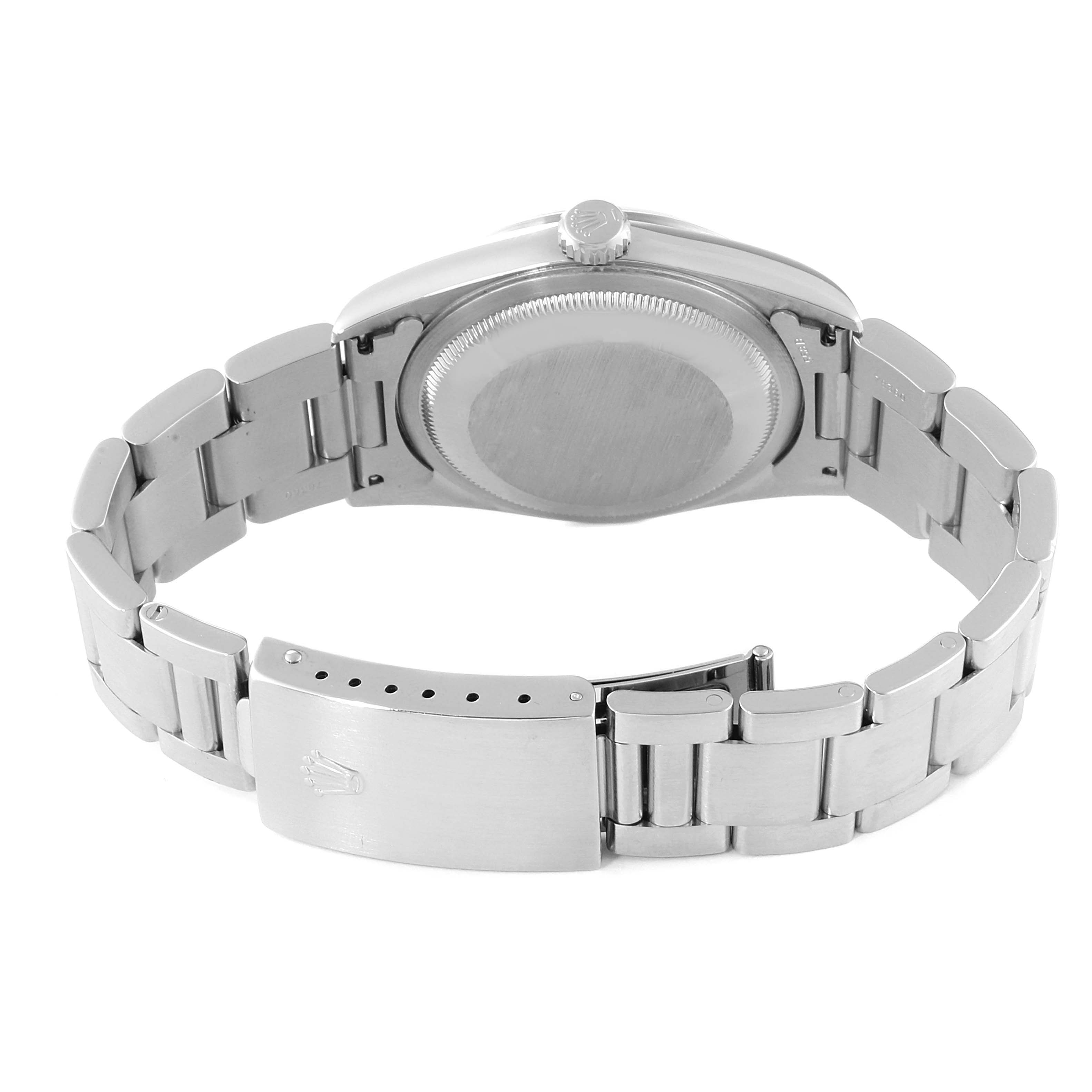 The image shows the back view of a Rolex Datejust 16200 Men's Stainless Steel White Dial 16200 Men's Stainless Steel White Dial watch, including its case back and bracelet with clasp.