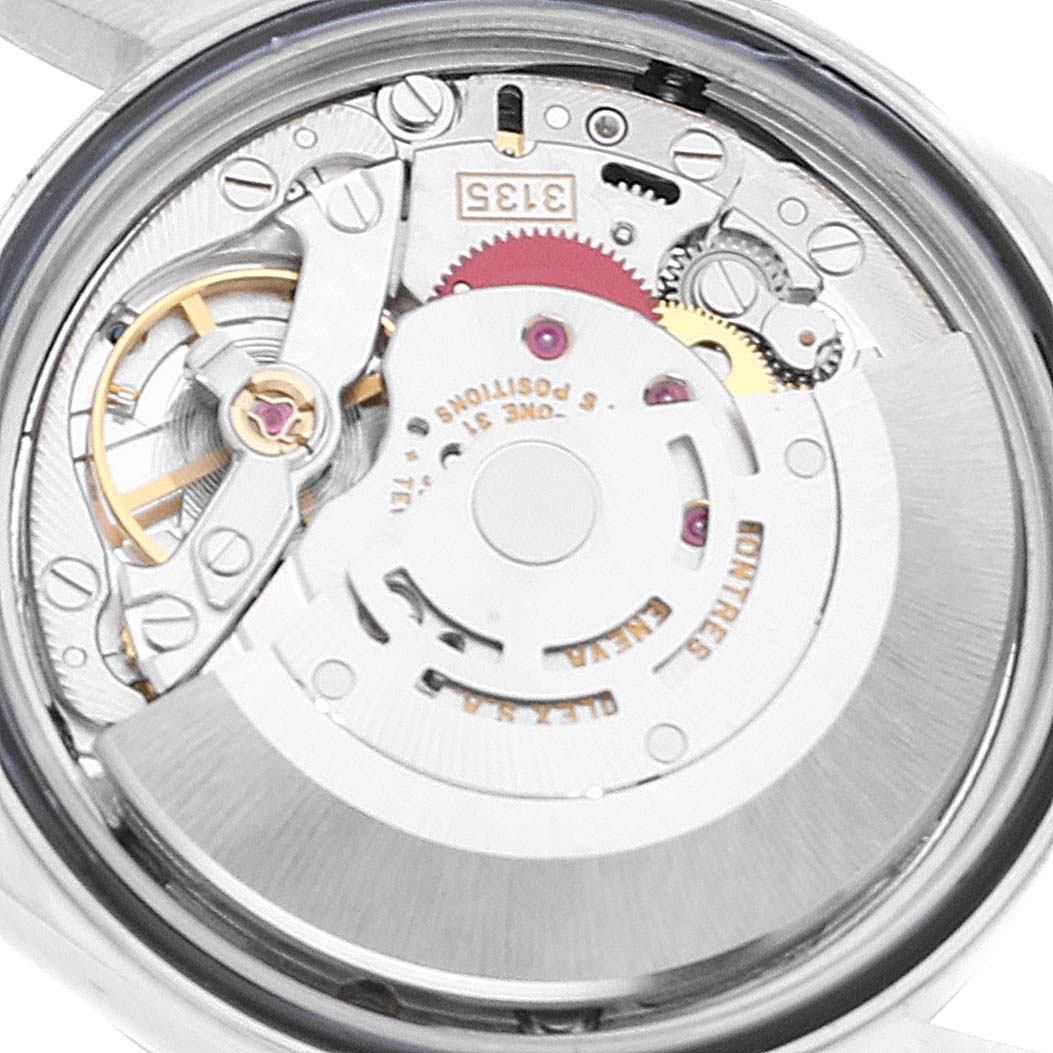 This image shows the internal mechanism of a Rolex Datejust 16200 Men's Stainless Steel White Dial 16200 Men's Stainless Steel White Dial watch, focusing on the movement and gears from a back angle.