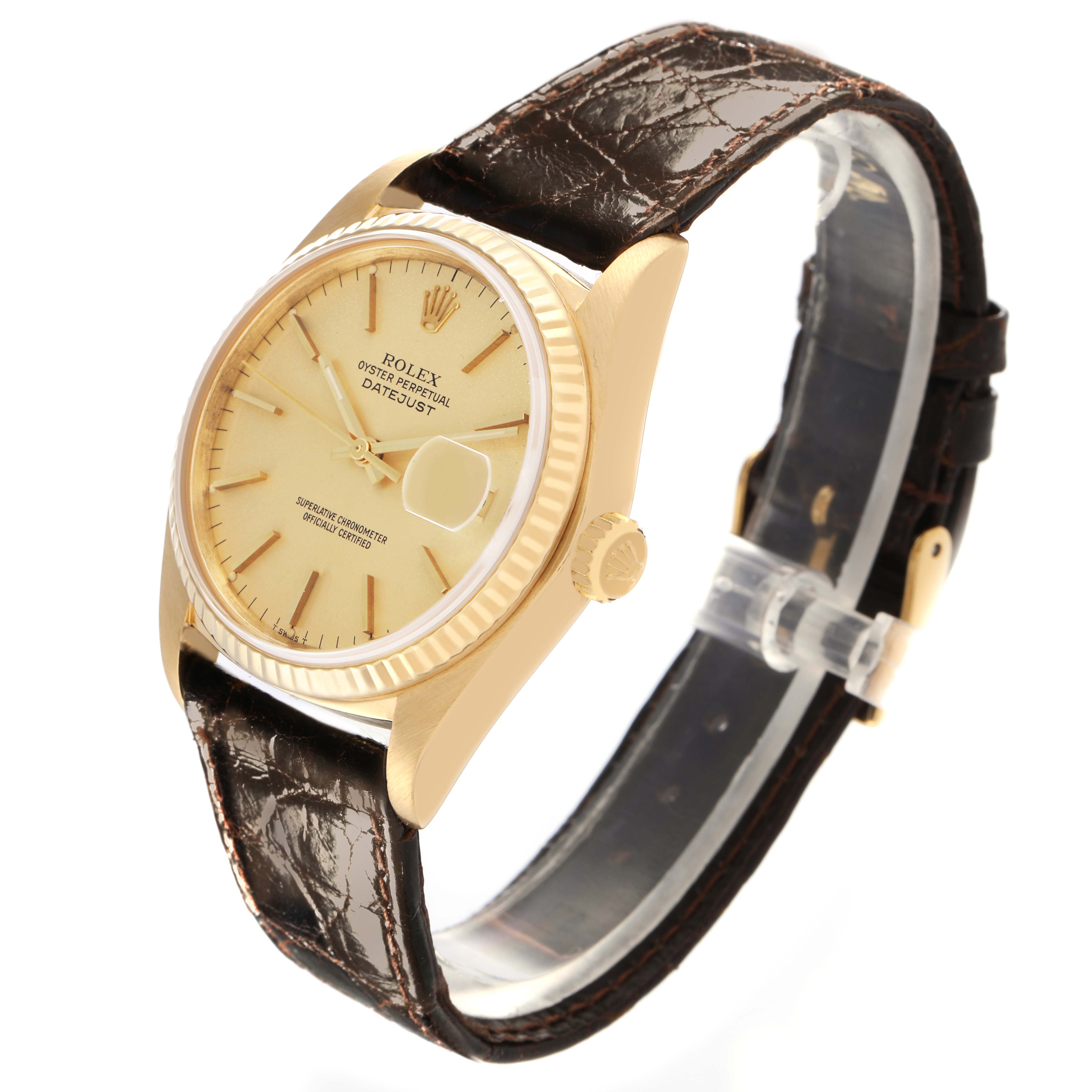 The Rolex Vintage Collection 16018 Men's Yellow Gold Champagne Dial 16018 Men's Yellow Gold Champagne Dial watch is shown at a diagonal angle, highlighting the dial, bezel, crown, and brown leather strap.