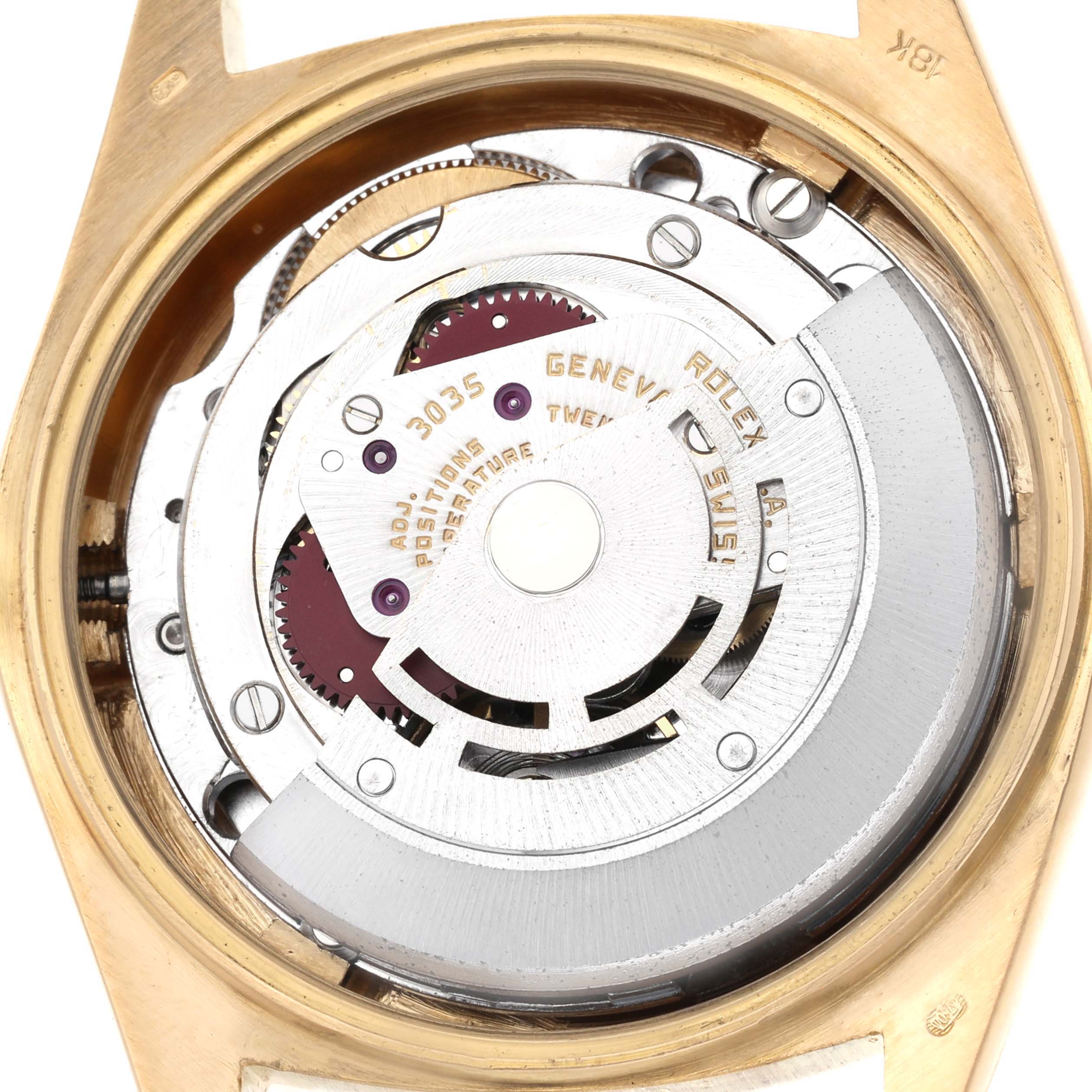 The image shows the internal mechanism of a Vintage Collection Rolex, viewed from the back, highlighting its movement components.