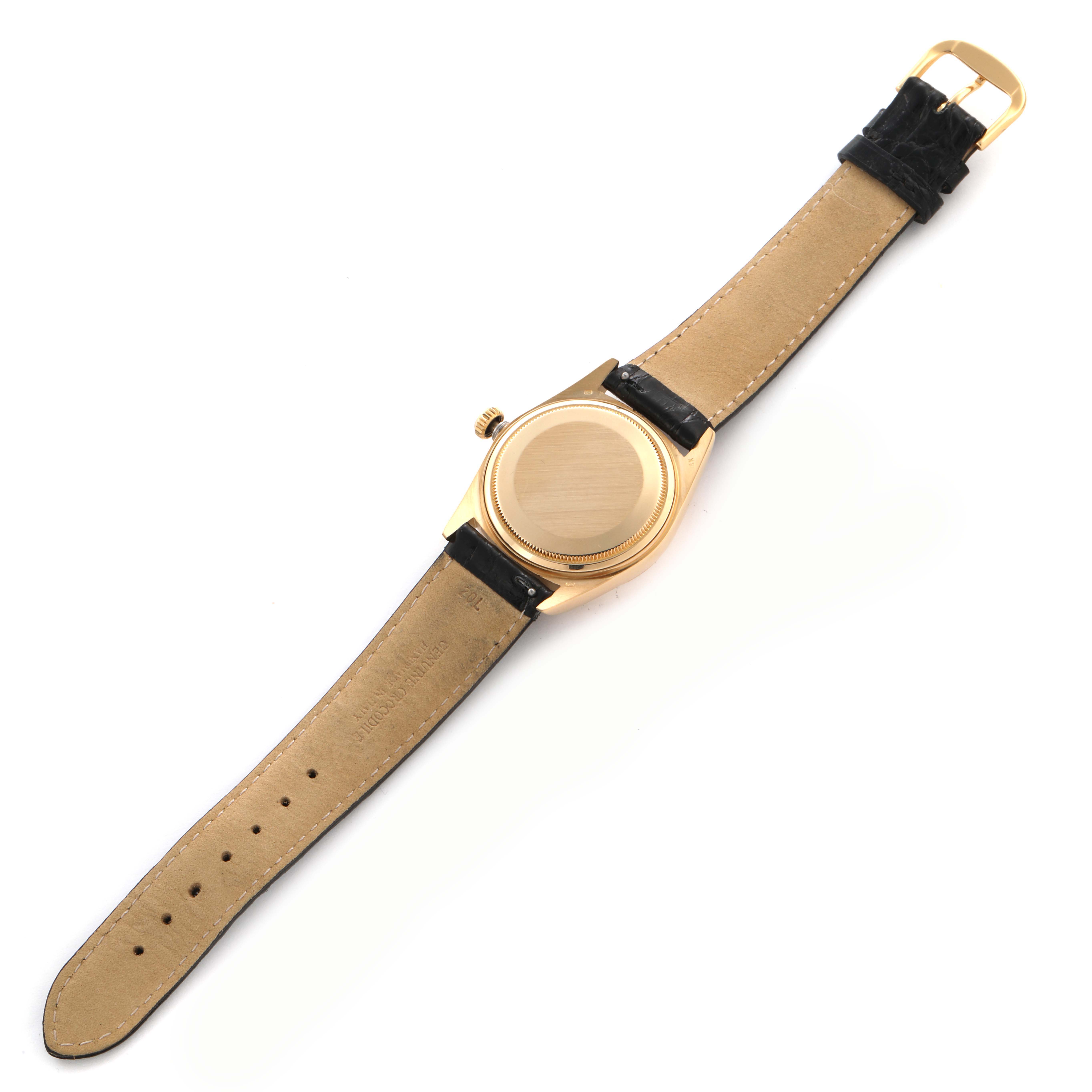 The image shows a Rolex Vintage Collection 16018 Men's Yellow Gold Blue Dial 16018 Men's Yellow Gold Blue Dial watch from the back, displaying the case back and the full leather strap.