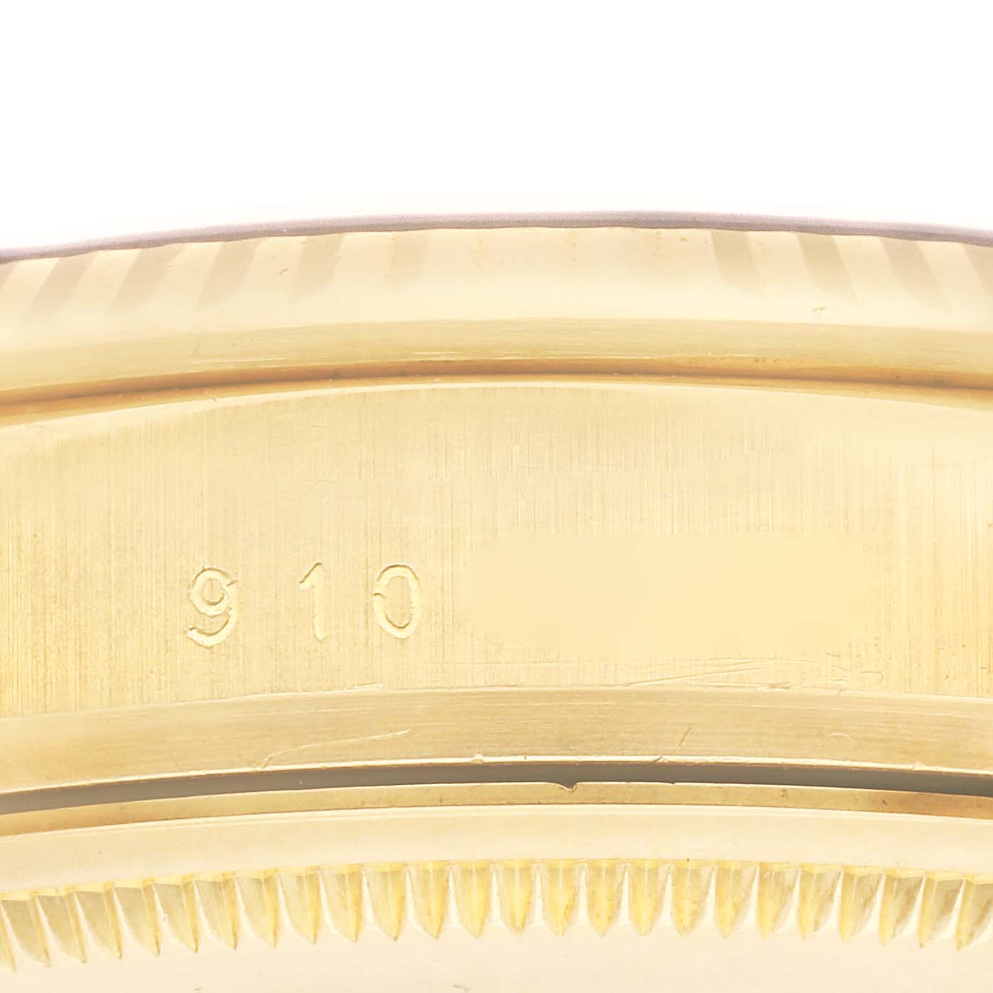 The image shows the side view of the case edge of a Rolex Vintage Collection 16018 Men's Yellow Gold Blue Dial 16018 Men's Yellow Gold Blue Dial watch, highlighting its engraved serial number.