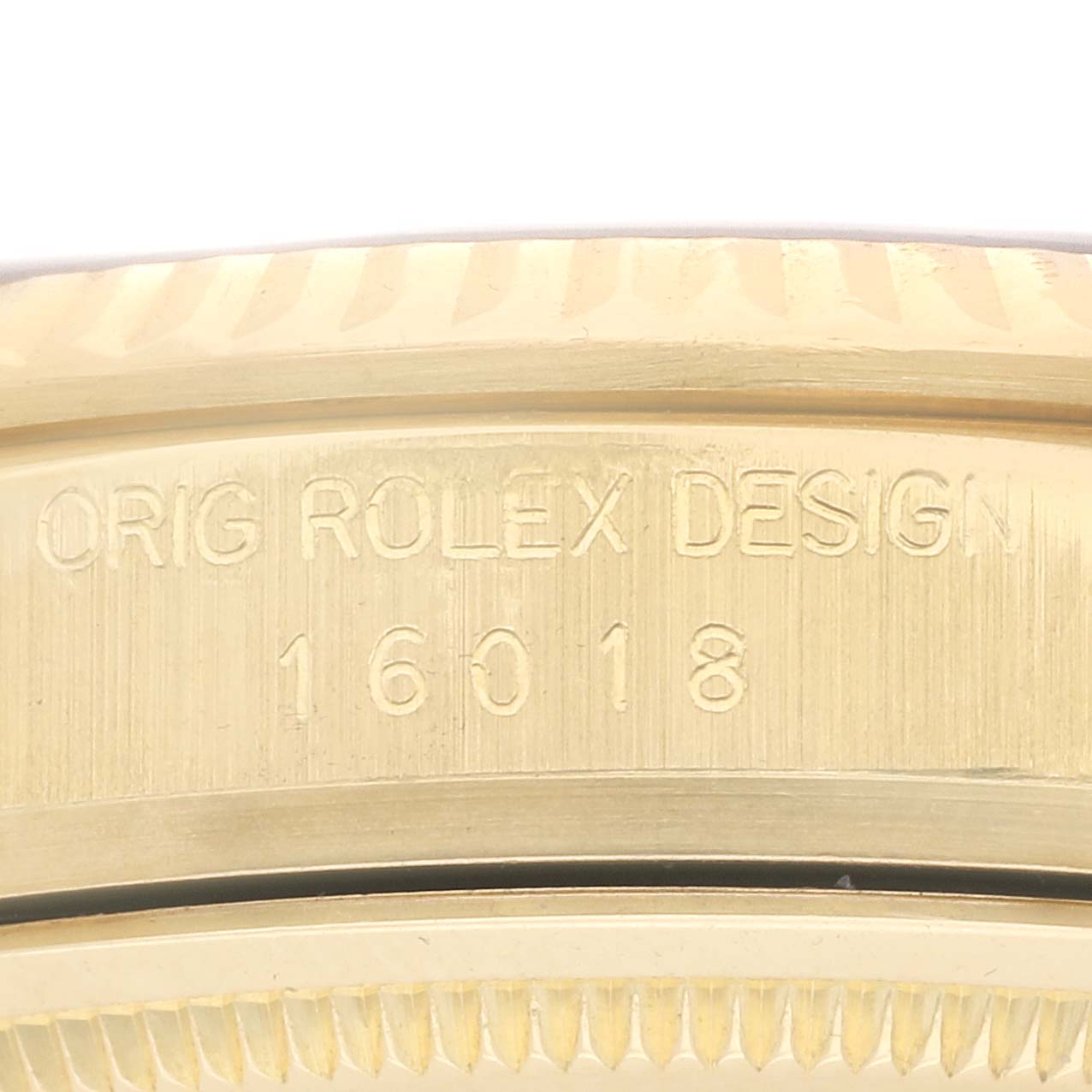 The image shows a close-up of the side engraving on a Vintage Collection Rolex watch, highlighting the design number "16018."